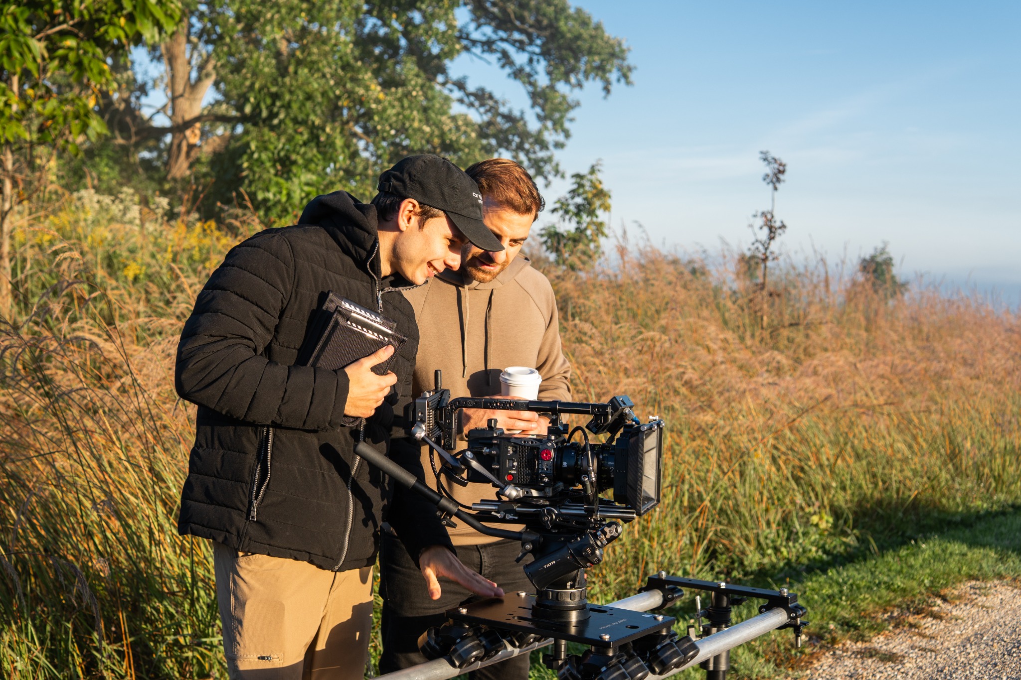 Crew members reviewing a camera setup on location