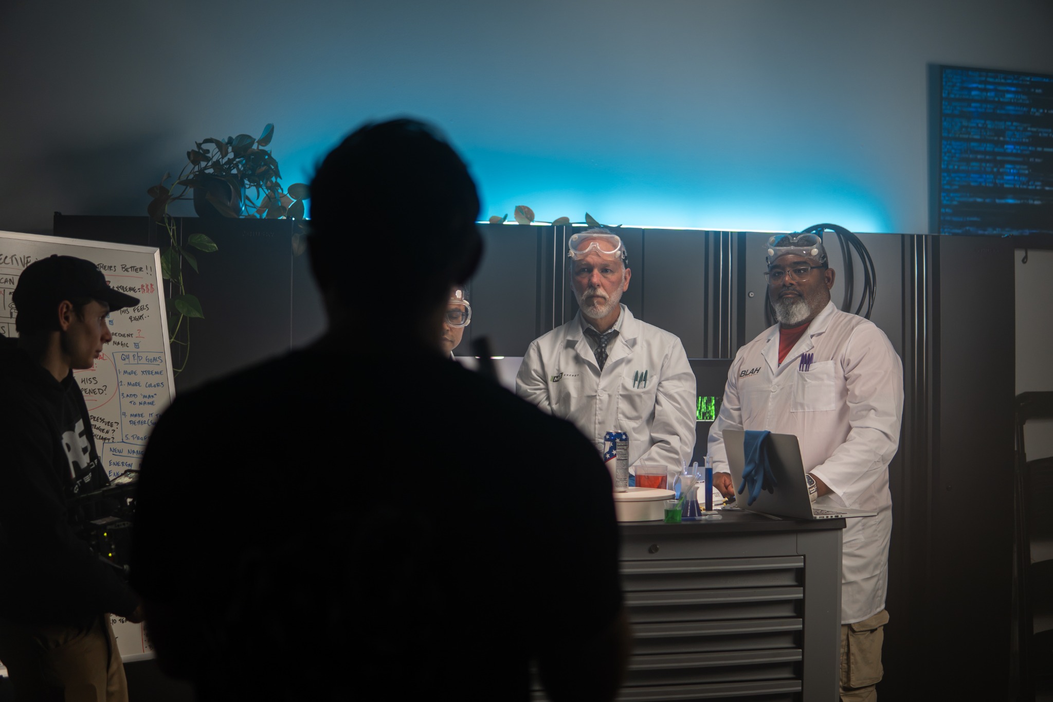 Crew filming a staged laboratory scene