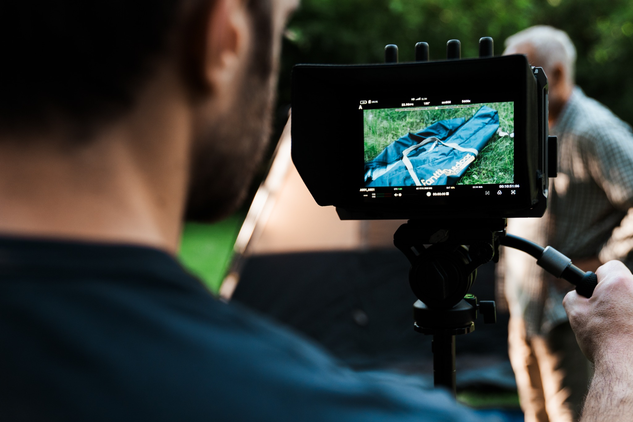 Production monitor framing a shot on set