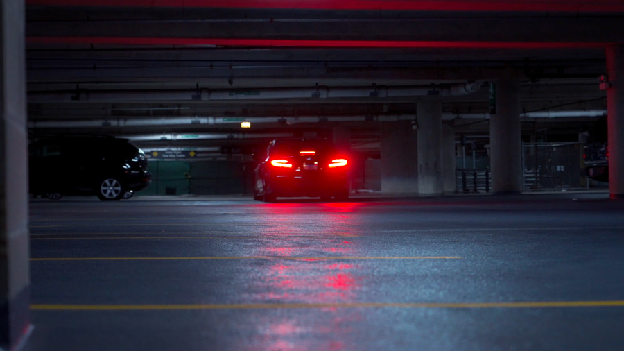 Red taillights in a parking garage