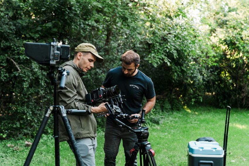 Crew preparing the camera at the campsite