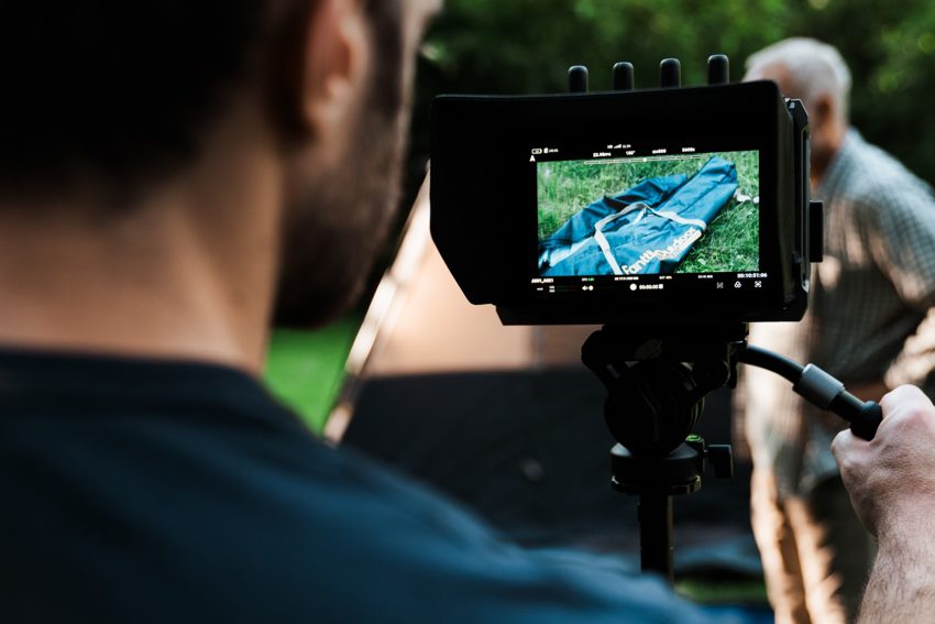 A campsite scene framed on the camera monitor